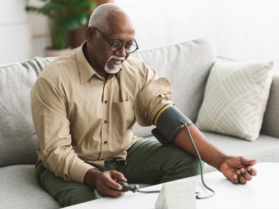 Older man measuring blood pressure