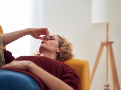Woman with long COVID on couch