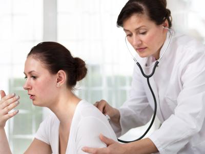 coughing patient and examining provider