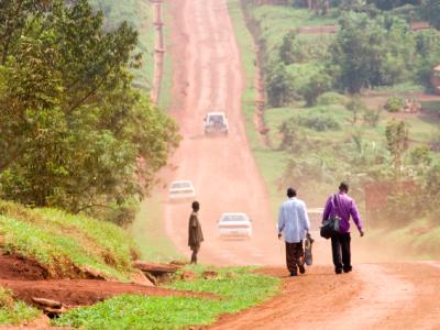 Travelers along African dirt road