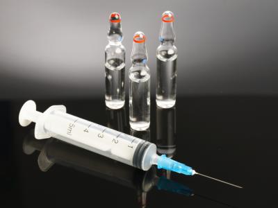 Vaccine vials and syringe