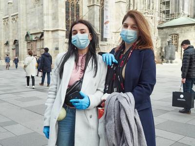 Austrian tourists wearing masks, gloves