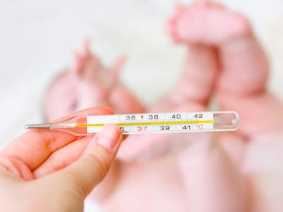 Baby with thermometer