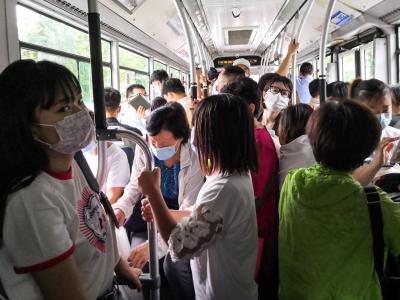 Bus commuters wearing masks in Beijing