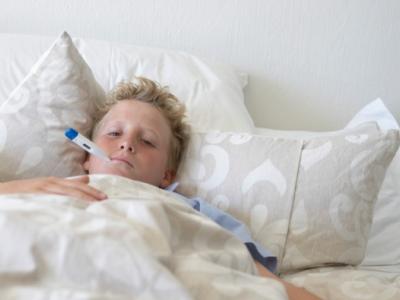 Boy sick in bed