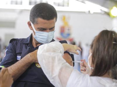 Brazilian police officer getting COVID vaccine