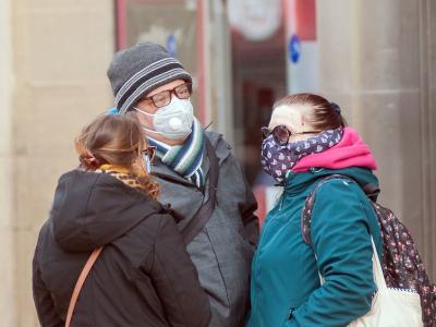 British pedestrians wearing medical masks