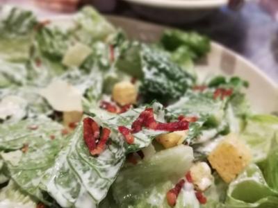 Caesar salad with beef pasta