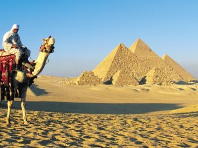Camel and rider at pyramids