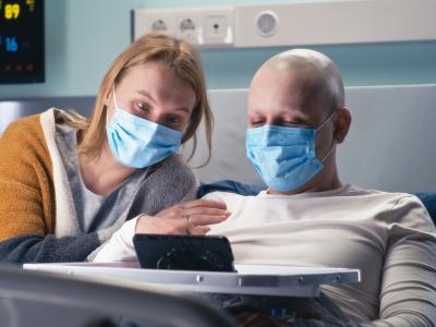 Cancer patient and visitor wearing masks
