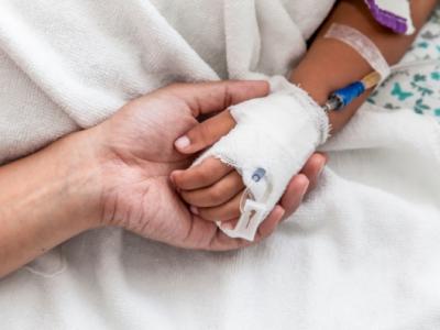 Child's hand in hospital with IV