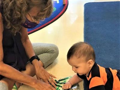Childcare worker with baby
