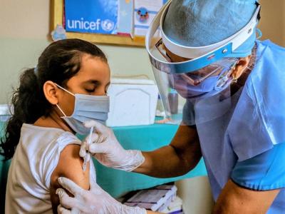 Girl receiving vaccine
