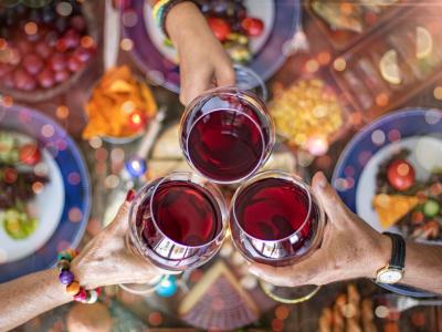 Clinking wine glasses at Thanksgiving