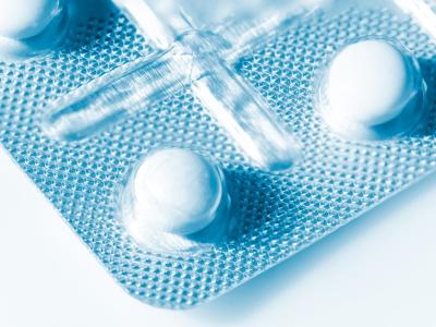 Closeup of white pills in bubble packet