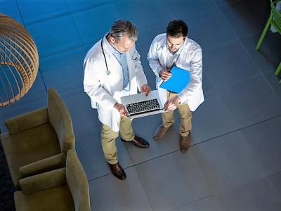 Doctor consult with laptop