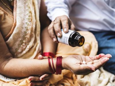 Couple in India with bottle of pills