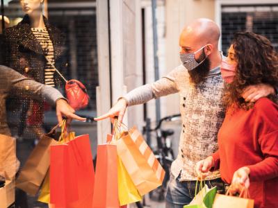 Couple wearing masks shopping