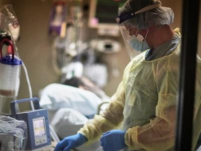Doctor at bedside of COVID-19 patient