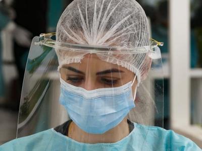 Health worker with face shield in Brazil