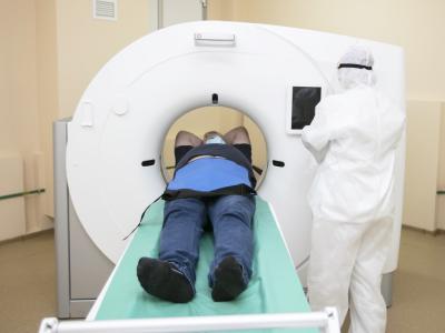 Man wearing mask getting an MRI