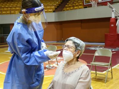 COVID nasal swab testing in gymnasium