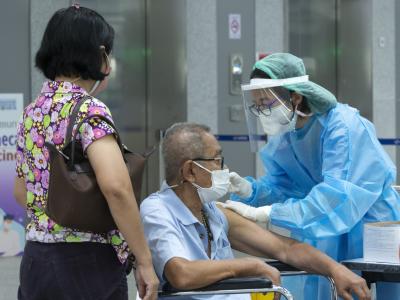 Older man getting COVID vaccine in Thailand