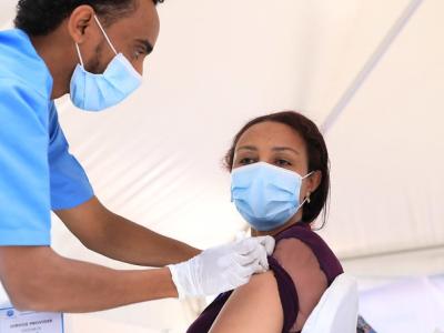 Woman getting COVID-19 vaccine