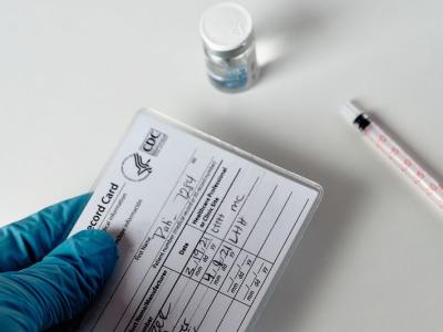 COVID vaccine card, vial, syringe
