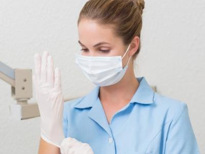 Dental assistant wearing mask