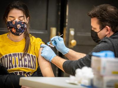 Teacher receiving the COVID-19 vaccine