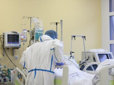 Healthcare worker at patient's bedside