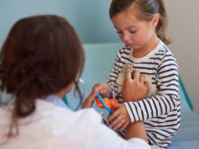 Doctor examining girl