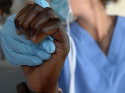Doctor holding patient's hand