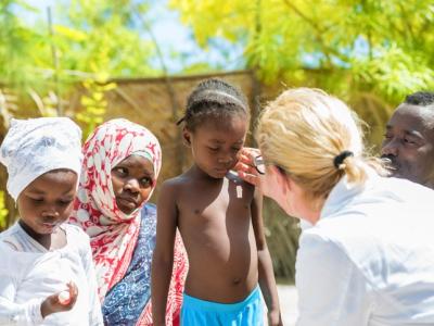 Doctor with African children