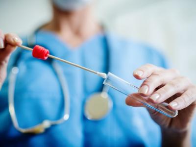 Doctor holding swab