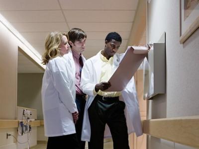 Doctors consulting in hallway