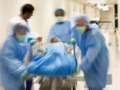 Doctors pushing gurney