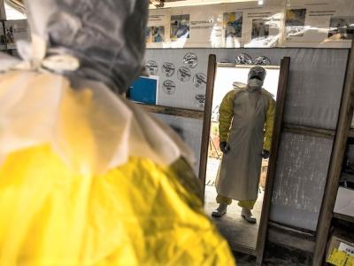 Ebola doctor's reflection in mirror