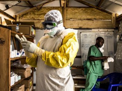 Ebola health worker donning gloves