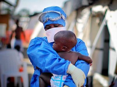 Ebola survivor holds baby