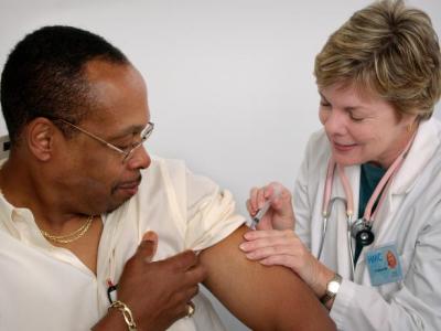 Person receiving flu shot.
