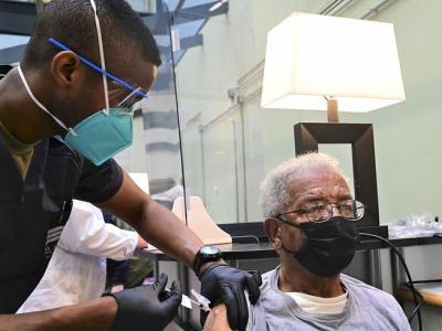 Elderly man getting COVID-19 vaccine