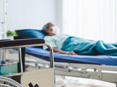 Elderly man in hospital bed