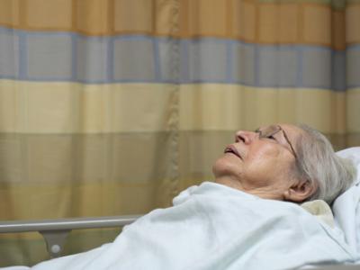 Elderly woman in hospital bed