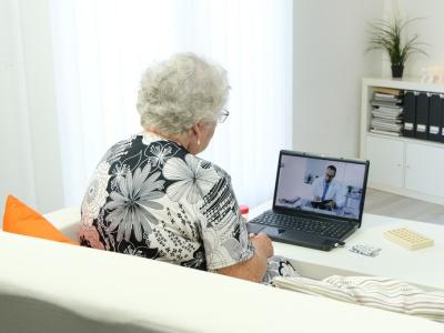 Elderly woman remote consult with doctor