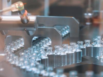 Empty glass bottles on production line