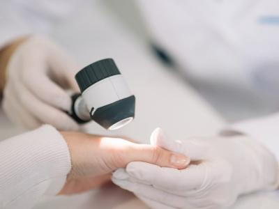 Examining hand of patient
