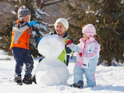 Family building snowman
