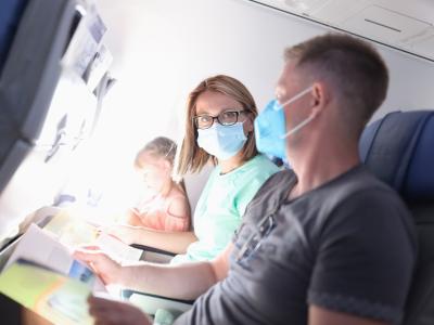 Couple wearing masks on plane